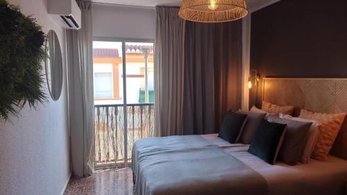 Ένα ή περισσότερα κρεβάτια σε δωμάτιο στο Carmen Apartamento Emilia