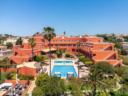 an aerial view of a resort with a swimming pool at Belavista Da Luz - Wellness & Lifestyle Hotel in Luz