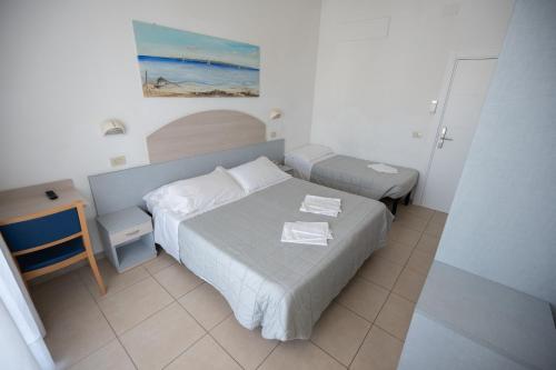 Ένα ή περισσότερα κρεβάτια σε δωμάτιο στο Hotel Petite Fleur