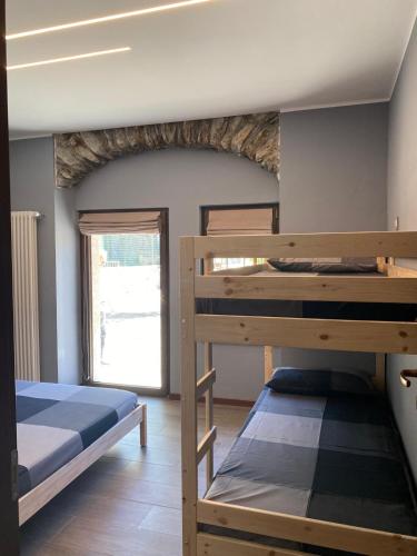 Postel nebo postele na pokoji v ubytování casa vacanze nigritella