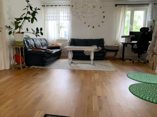 a living room with a couch and a table at Villa in Surte