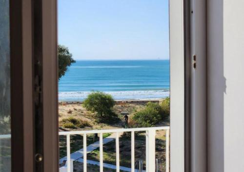 a view of the ocean from a window at Keys of Sicily - Residence "Sabbia" sul mare in Marina di Modica