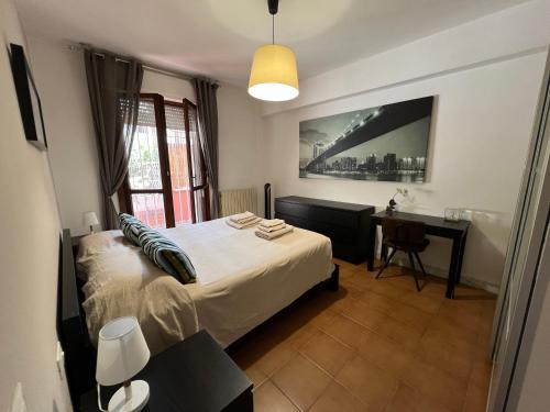 Ένα ή περισσότερα κρεβάτια σε δωμάτιο στο Il Parco Apartments