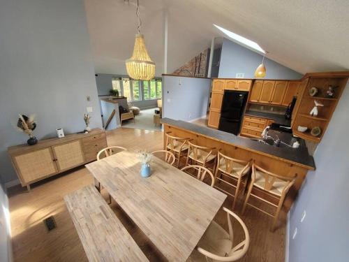 a kitchen with a table and chairs in a room at ReTreat yourself in Port Franks in Lambton Shores