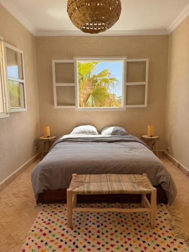 a bedroom with a large bed and a window at Luxurious Villa in Mirleft