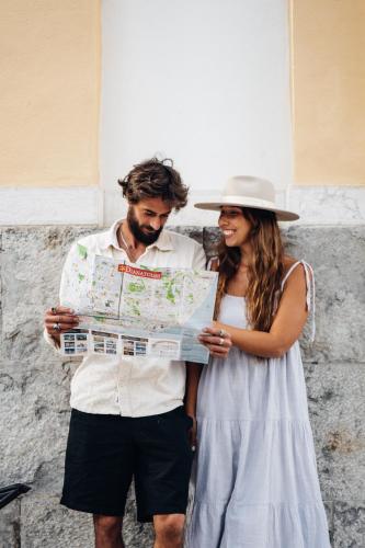 a man and a woman looking at a map at Stay Hotel Lisboa Centro Saldanha in Lisbon