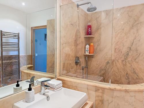 a bathroom with a shower with a sink and a shower at La plus belle vue sur mer à Juan les Pins in Antibes