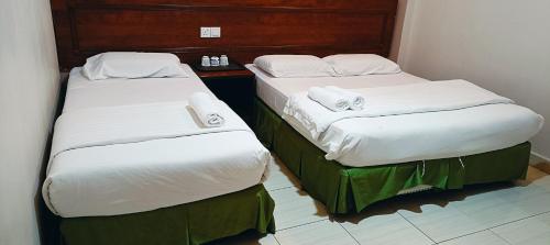 Cama o camas de una habitación en Kampar Times Inn Hotel