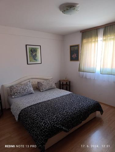 Postel nebo postele na pokoji v ubytování Apartments Salute