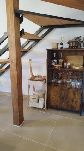 a kitchen with a wooden cabinet in a room at Holiday house "Acacia", for two with pool, Dol in Stari Grad