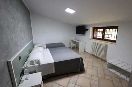 Ένα ή περισσότερα κρεβάτια σε δωμάτιο στο Bed and Breakfast a casa di Valerio