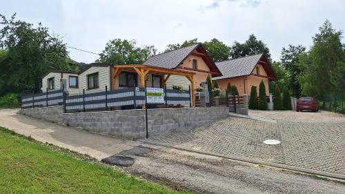 a house being built with a retaining wall at Bungalows Michalka - Podhájska in Podhájska
