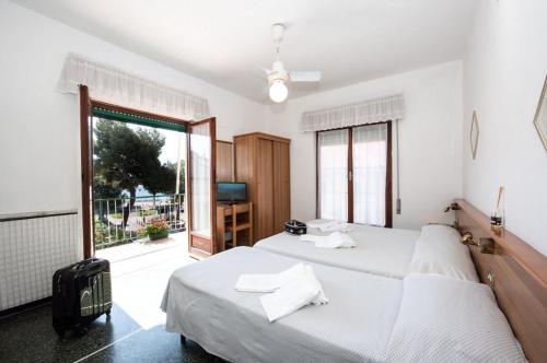 Ένα ή περισσότερα κρεβάτια σε δωμάτιο στο Hotel Tirreno