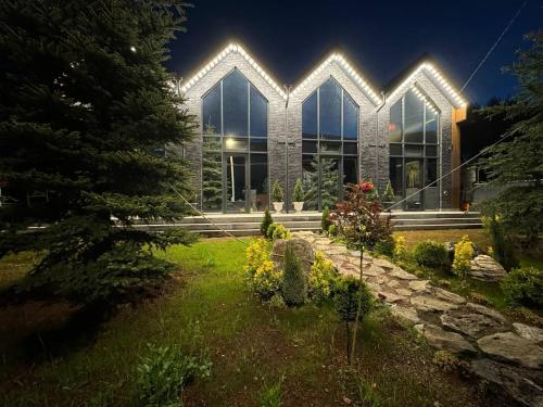 a large building with lights on the front of it at Loft Tsaghkadzor in Tsaghkadzor