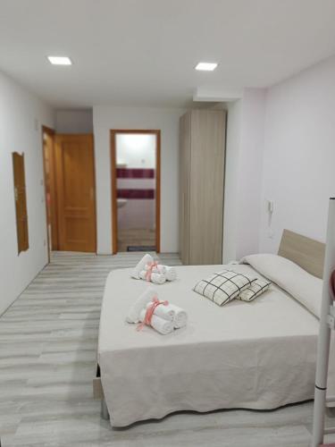 a bedroom with two beds with towels on them at B&B PalmaViola in Caserta