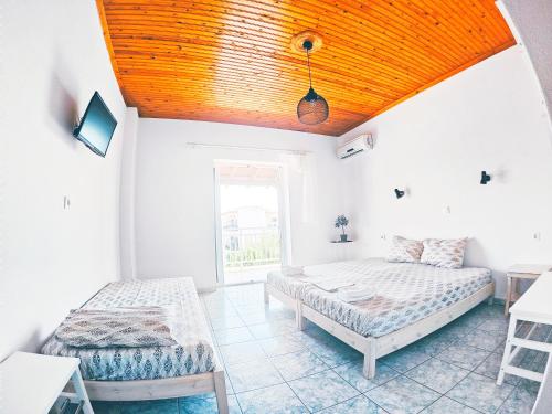 Postel nebo postele na pokoji v ubytování House Charistos