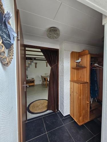 a hallway with a door leading into a room at Ferienhaus Albers in Oberlangen