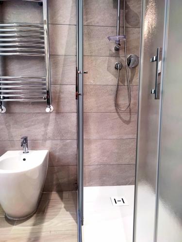 a bathroom with a shower and a sink at Al Teatro Suites in Foggia