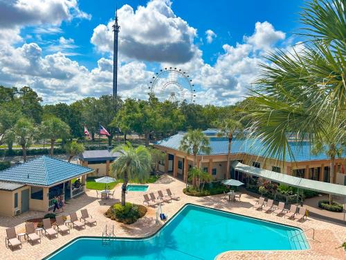an aerial view of a resort with a pool and a ferris wheel at Hotel SonoHotel IDrive District in Orlando