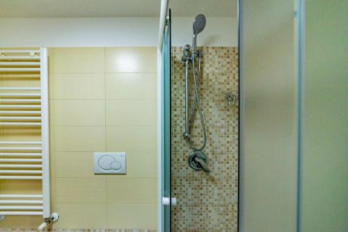 a shower in a bathroom with a glass door at Casa Simona in Noicattaro