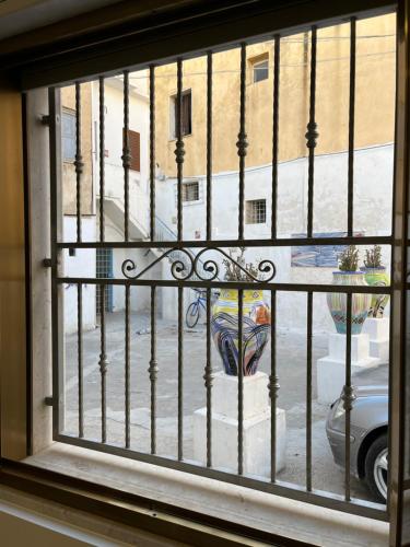 a window with a view of a fire hydrant at Al canto del Muezzin - Apartment in Mazara del Vallo