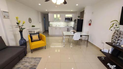 a living room with a couch and a table and chairs at Charming & Family-Friendly Boqueron Village Condos! in Boqueron