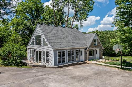 a house with a basketball hoop in a driveway at Tranquil Mountain Escape Luxurious 2 Bedroom 2 Bath Cottage on 9 Acres in Maryville