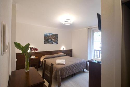 Postel nebo postele na pokoji v ubytování Albergo Miniere