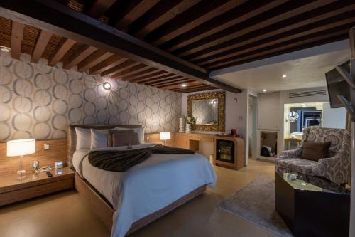 Postel nebo postele na pokoji v ubytování 1850 Hotel Boutique