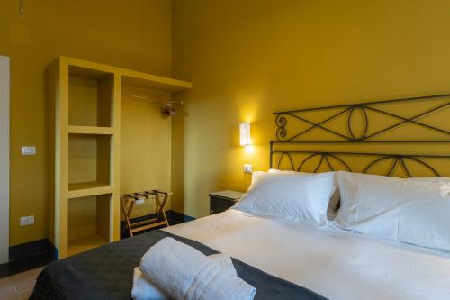 Letto o letti in una camera di Masseria La Presentina
