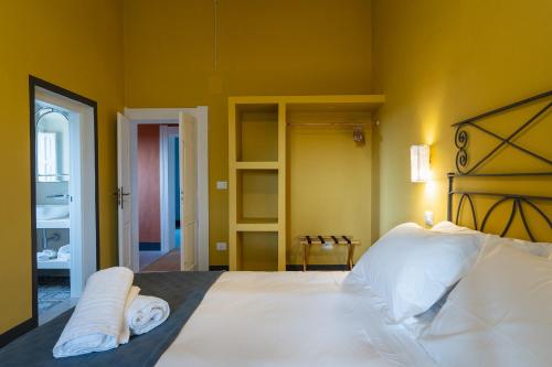 Letto o letti in una camera di Masseria La Presentina