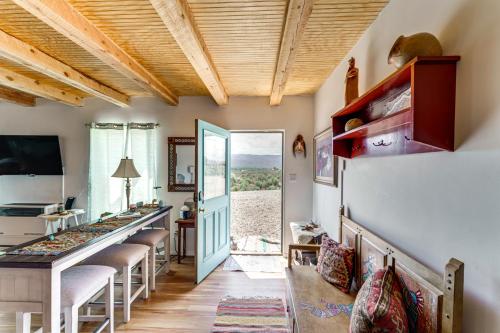 a room with a bar with stools and a window at Pet-Friendly El Prado Vacation Rental with Views! in El Prado