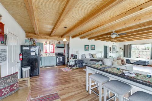 a kitchen and living room with a table and chairs at Pet-Friendly El Prado Vacation Rental with Views! in El Prado