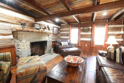 a living room with a couch and a fireplace at Extended Stays by Lee House Inn in Maysville