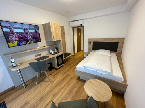 Postel nebo postele na pokoji v ubytování Hotel Wilms