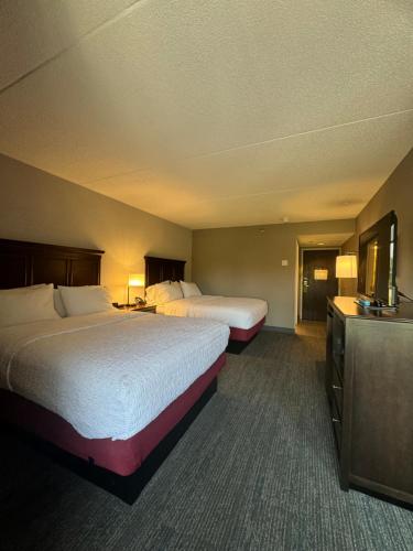 a hotel room with two beds and a television at Hampton Inn New Bedford/Fairhaven in Fairhaven