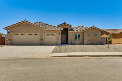 a large house with two garages on a street at Year-Round Yuma Escape Near Dtwn Pets Welcome! in Fortuna