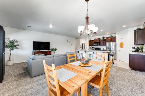 a kitchen and living room with a table and a couch at Year-Round Yuma Escape Near Dtwn Pets Welcome! in Fortuna