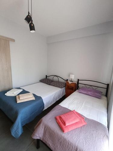 Ένα ή περισσότερα κρεβάτια σε δωμάτιο στο NP apartment