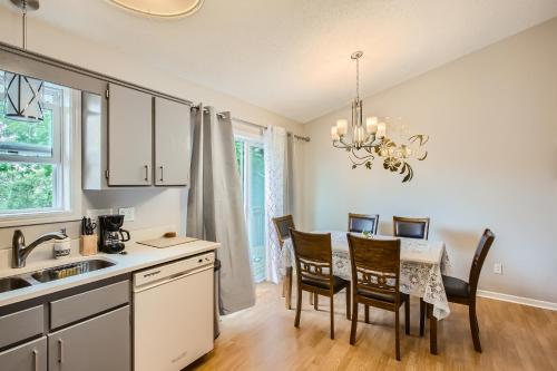 a kitchen and dining room with a table and chairs at 4bd Central Location - Patio - Games in Ramsey