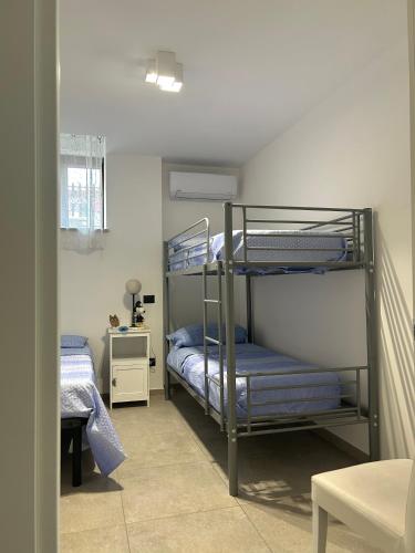 a bedroom with two bunk beds in a room at Il Boschetto in Torgiano