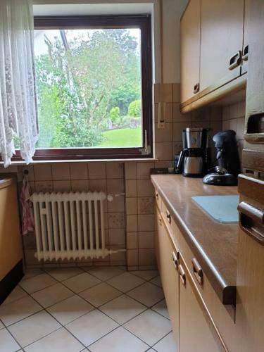 a kitchen with a window and a counter top at Haus Thea bei Stuttgart in Leonberg