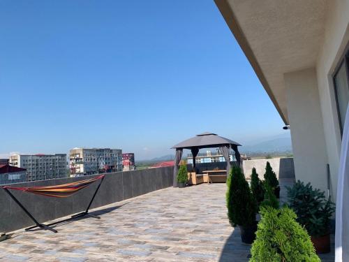 a balcony with a gazebo on a building at Penthouse Sea Breeze in K'obulet'i