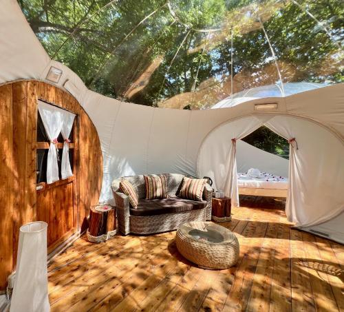 a living room with a couch in a tent at Rock and Sea Resort in Watamu