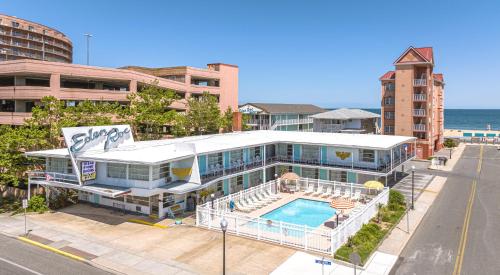 a large house with a swimming pool next to the ocean at Eden Roc Motel in Ocean City