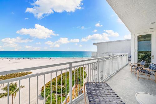 a balcony with a view of the beach at Jamaica Royale Beachfront Tower By Beachside Management in Siesta Key