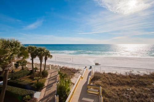 a view of the beach from the balcony of a resort at Beachside Resort Panama City Beach in Panama City Beach