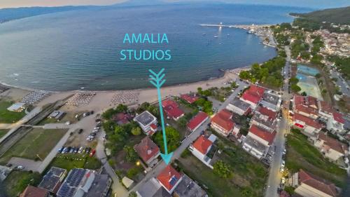 an aerial view of a city and the ocean at Amalia in Stavros