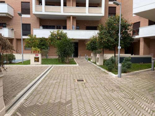 an empty street in front of a building at AGM Suite Rome Airport Leonardo in Fiumicino