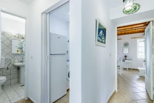 a bathroom with a toilet and a sink at Skopelos Sunset traditional country house in Panormos Skopelos